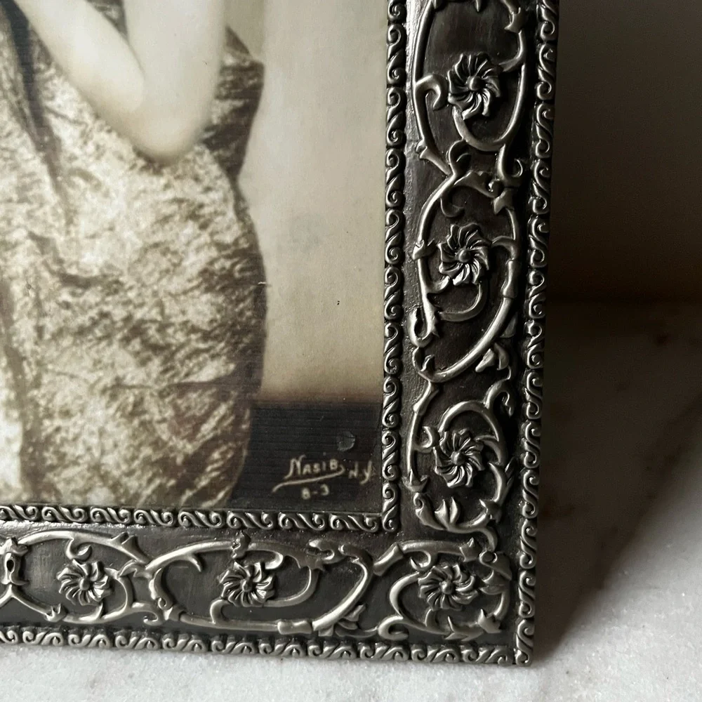 Large ornate silver Frame for photo 8”x10” free standing..